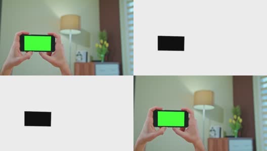 男性手持绿色屏幕的手机高清在线视频素材下载