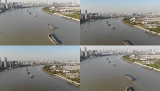 在上海市中心的黄浦江上有许多驳船和船只。高清在线视频素材下载
