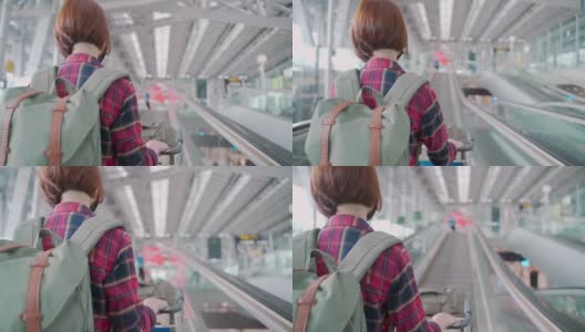 后视图在机场自动扶梯上佩戴防护口罩的亚洲女性游客高清在线视频素材下载
