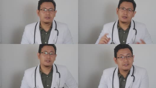 亚洲男医生对着摄像机说话，在视频通话中给出建议。在线医生远程医疗远程保健概念高清在线视频素材下载