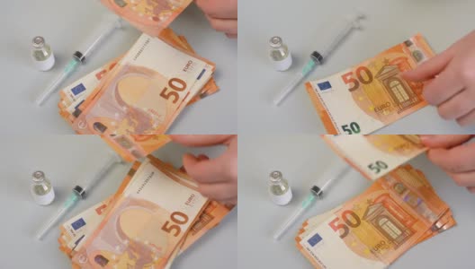 一个人在数购买药品、疫苗、欧盟货币的50欧元钞票高清在线视频素材下载