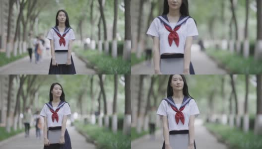 年轻的亚洲女人拿着笔记本电脑高清在线视频素材下载
