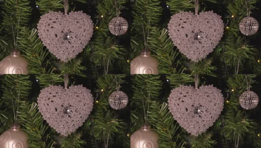 圣诞树装饰。近距离观察银色闪烁的心脏。圣诞节的时候高清在线视频素材下载