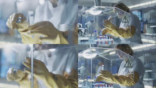 高级女科学家在隔离手套箱中处理样品。她在一个配备了最先进技术的现代实验室里。高清在线视频素材下载