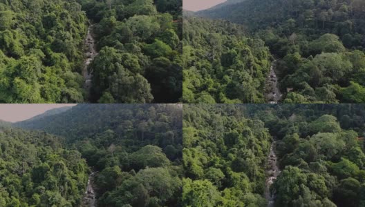 4k鸟瞰图的溪流瀑布在热带森林和山区。高清在线视频素材下载