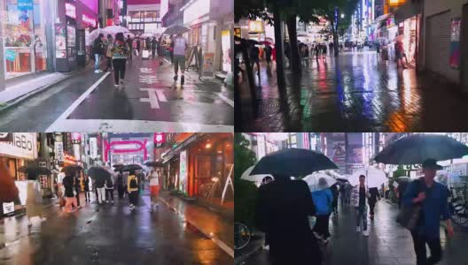 在下雨的时候，拥挤的人们在城市里散步、购物和过马路高清在线视频素材下载