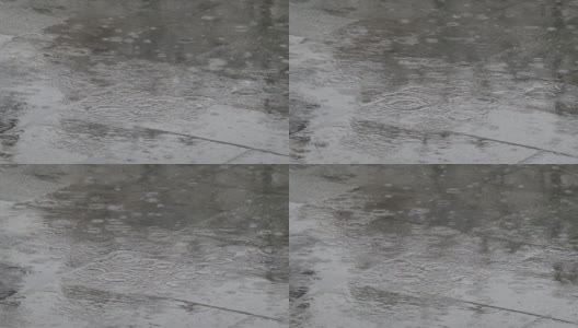 雨点缓缓地落在灰色的瓷砖地板上。这给了一个孤独的心情在雨季，看雨水的运动到地板上蔓延的谷粒。高清在线视频素材下载