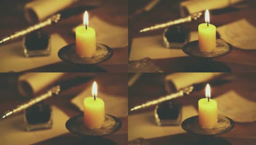 复古羽毛笔和复古物品在桌上的烛光高清在线视频素材下载