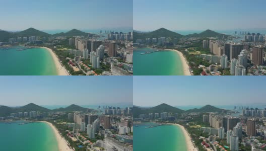 阳光明媚的三亚著名的大东海海滩湾岛航拍全景4k中国海南高清在线视频素材下载