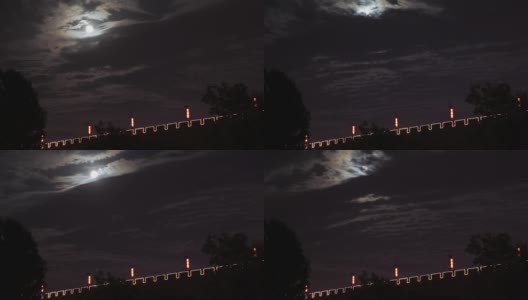 中国陕西西安，在夜晚的天空和西安城墙上，云在移动高清在线视频素材下载