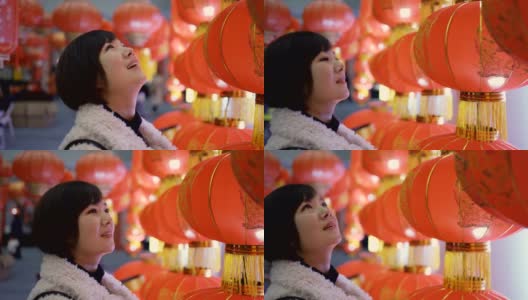 挂灯笼的女人庆祝中国春节高清在线视频素材下载