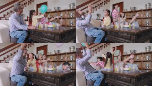多代同堂的中国家庭在家庆祝孩子的生日高清在线视频素材下载