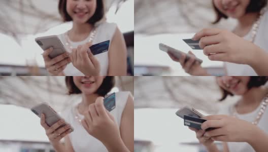 用智能手机在网上购物的女人高清在线视频素材下载