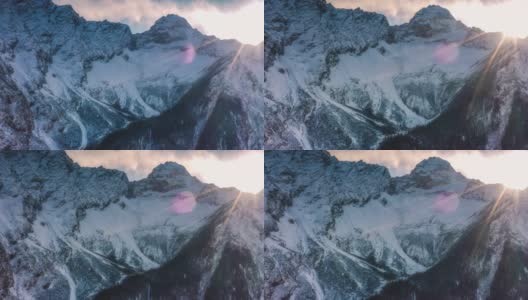 日落时分，在灯光的映衬下，壮丽的雪山被拍摄下来高清在线视频素材下载