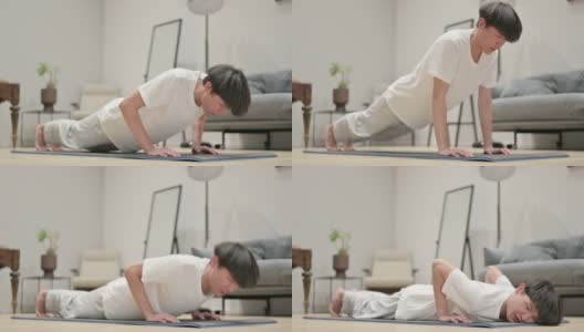 疲惫的亚洲男人在瑜伽垫上做俯卧撑在家高清在线视频素材下载