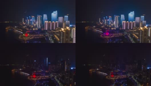 著名的夜景照亮了青岛，著名的市中心海湾纪念碑，航拍延时全景4k中国高清在线视频素材下载