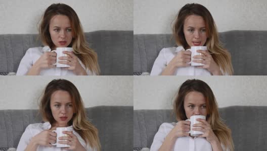 心烦意乱的女孩喝咖啡高清在线视频素材下载