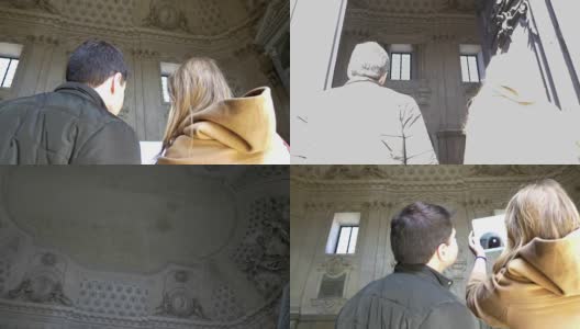 两个人在古建筑内用pad拍照高清在线视频素材下载