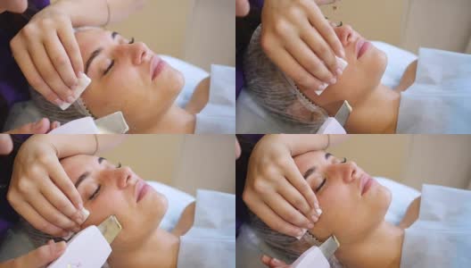 面部皮肤护理。女人在做面部超声波清洁高清在线视频素材下载
