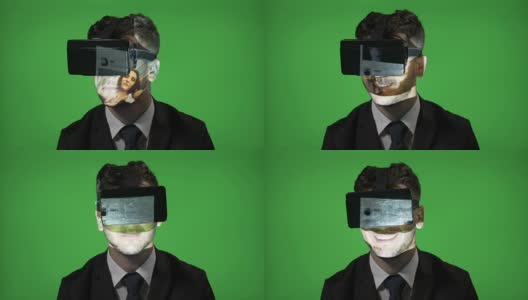 一名男子戴着虚拟现实眼镜在绿色屏幕上滚动他的社交媒体账户高清在线视频素材下载