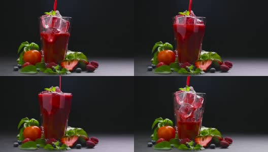将甜菜根和浆果汁倒入玻璃杯的慢动作高清在线视频素材下载