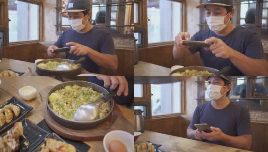 在日本料理馆里，一名男子戴着口罩吃日本炒饭高清在线视频素材下载