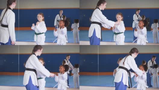两个女孩和跆拳道课的老师高清在线视频素材下载