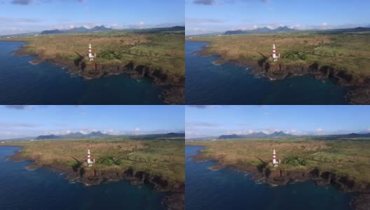 背景是毛里求斯岛和岩石海岸线。灯塔。灯塔d 'Albion高清在线视频素材下载