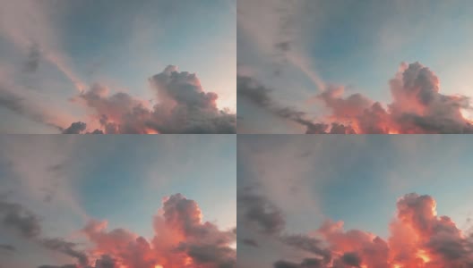 色彩斑斓的粉彩云彩和戏剧性的日落，青蓝的天空高清在线视频素材下载