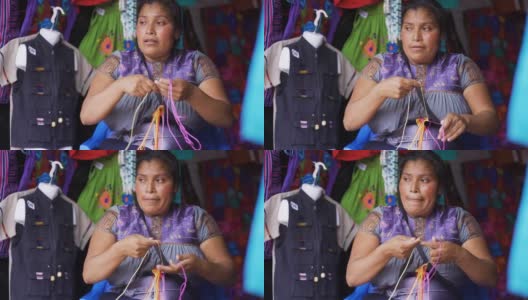 年轻的墨西哥妇女正在刺绣当地典型的衬衫和衬衫高清在线视频素材下载