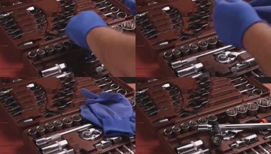 戴着工作手套的汽车或摩托车修理工的手正在使用一种专业工具——扳手。高清在线视频素材下载