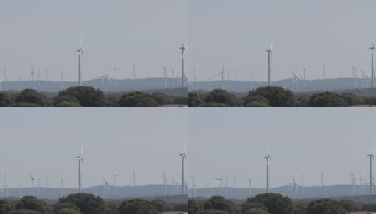 绿色技术，清洁和可再生能源解决方案，美丽的风车涡轮机利用清洁，绿色的风能在西班牙的油田。风车发电技术高清在线视频素材下载