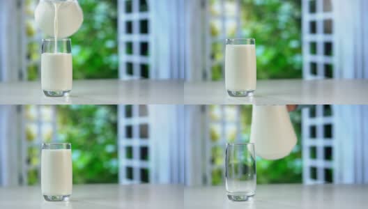 特写从罐子里倒新鲜牛奶到桌子上高清在线视频素材下载