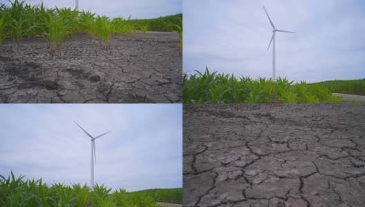 农田上风力涡轮机附近的干燥土地。生态系统概念高清在线视频素材下载