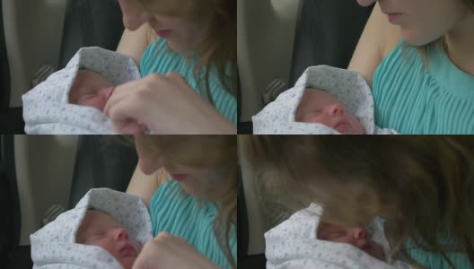 新出生的婴儿睡在妈妈的手里高清在线视频素材下载