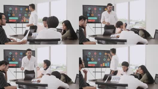 4K商人在商务会议上做演示。创意商务团队会议在现代玻璃办公室，多民族的人在电脑屏幕上工作的组合团队项目高清在线视频素材下载