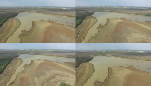 由于干旱在水库大坝为农业和饮用后退水的鸟瞰图高清在线视频素材下载