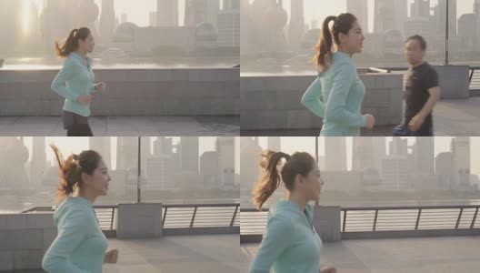 在城市环境中慢跑的亚洲女人高清在线视频素材下载