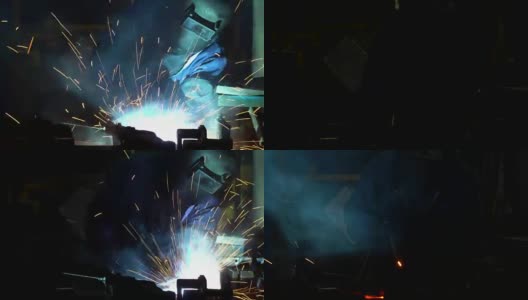 工业工人正在汽车工厂用面罩焊接金属零件高清在线视频素材下载