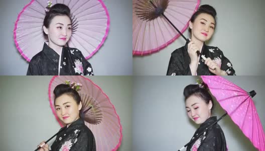 美丽的艺妓穿着传统的日本和服和粉红色的阳伞高清在线视频素材下载