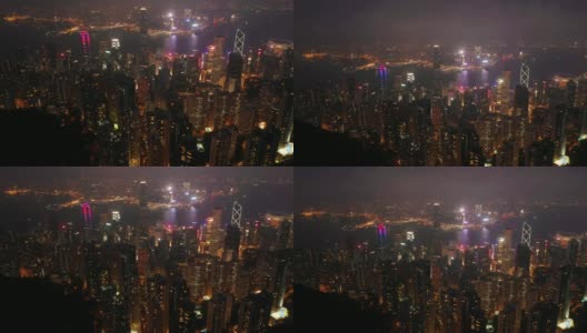 夜间照亮香港市景维多利亚山顶空中全景4k高清在线视频素材下载