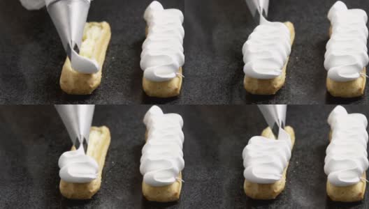 糕点师将奶油涂在美味的泡芙上高清在线视频素材下载