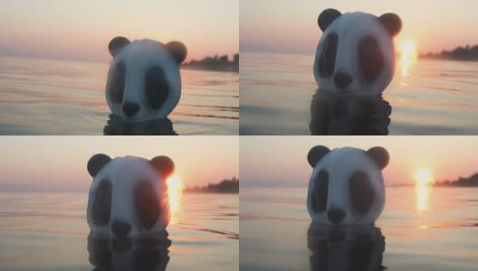暑假里，海里的男人戴着熊猫头面具高清在线视频素材下载