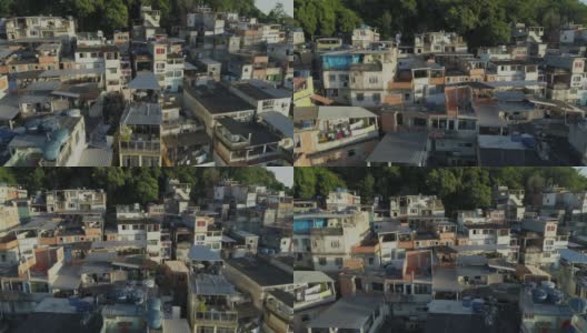日出时分，巴西里约热内卢，空中追踪经过山顶上密集的贫民窟住宅高清在线视频素材下载