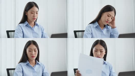 一段女商人在办公室用笔记本电脑工作时看起来很焦虑的4k视频高清在线视频素材下载