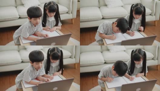 亚洲孩子用笔记本电脑画画高清在线视频素材下载