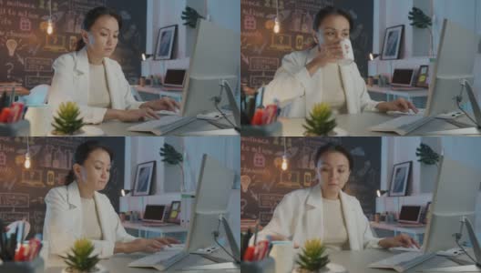 亚洲企业家在晚上用电脑打字和喝咖啡的慢镜头高清在线视频素材下载