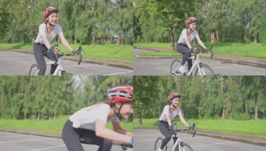 亚洲年轻美丽的女人骑自行车健康在公共公园。活跃的运动员运动女孩穿着运动服感到清新和放松，在晚上骑行锻炼，保健和健康高清在线视频素材下载