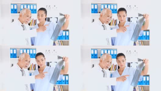 高级医生向医学生讲解x光图像高清在线视频素材下载
