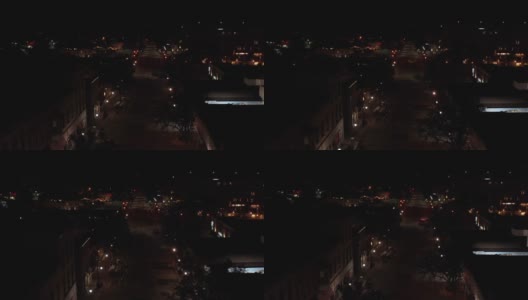 夜间内珀维尔街道令人惊叹的鸟瞰图。在伊利诺斯州，晚上小十字路口的车流量较小。夜间，无人机在伊利诺伊州内珀维尔市的城市道路上空飞行。高清在线视频素材下载